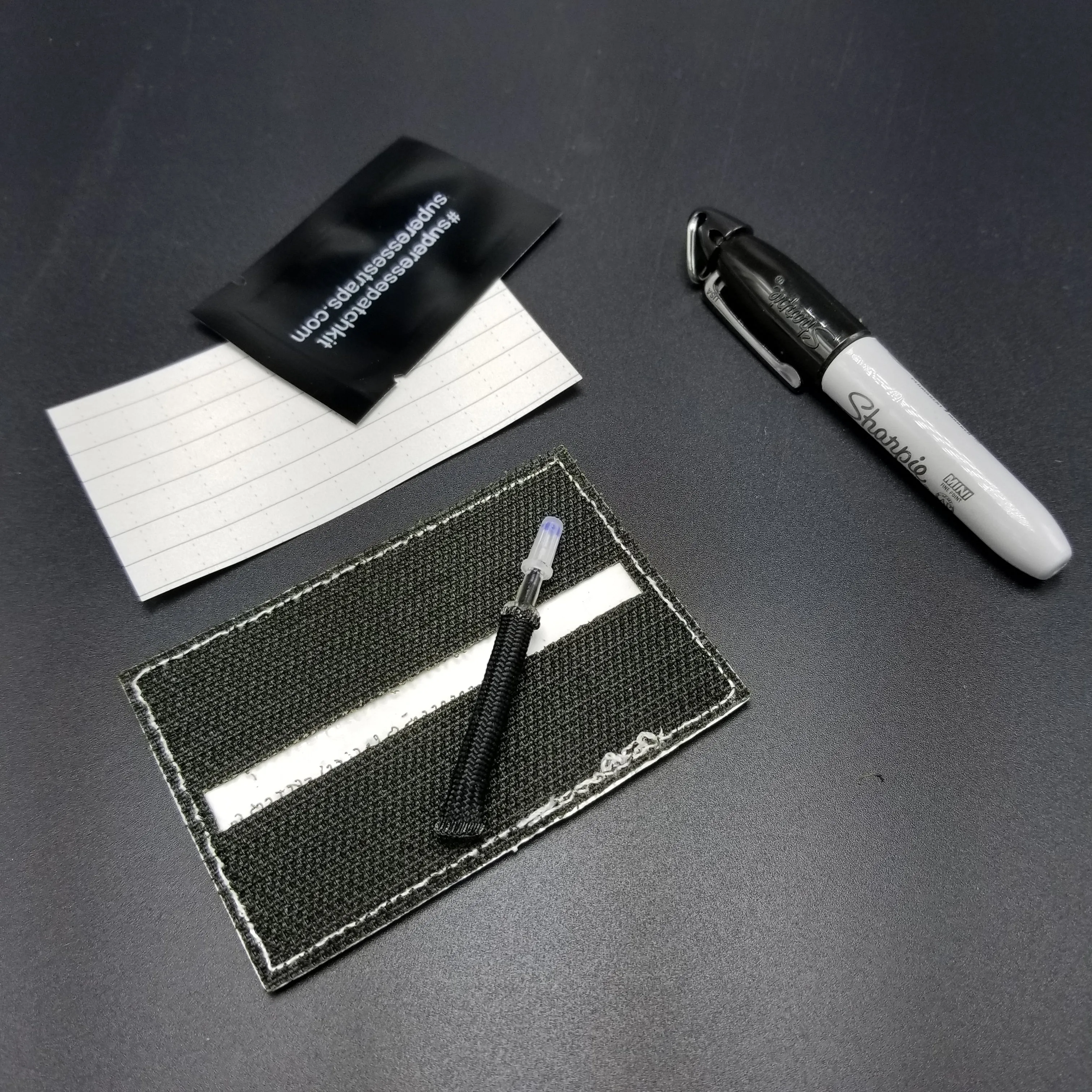 Note Patch Kit: Writable PVC surface for field notetaking with illuminated memo graph.