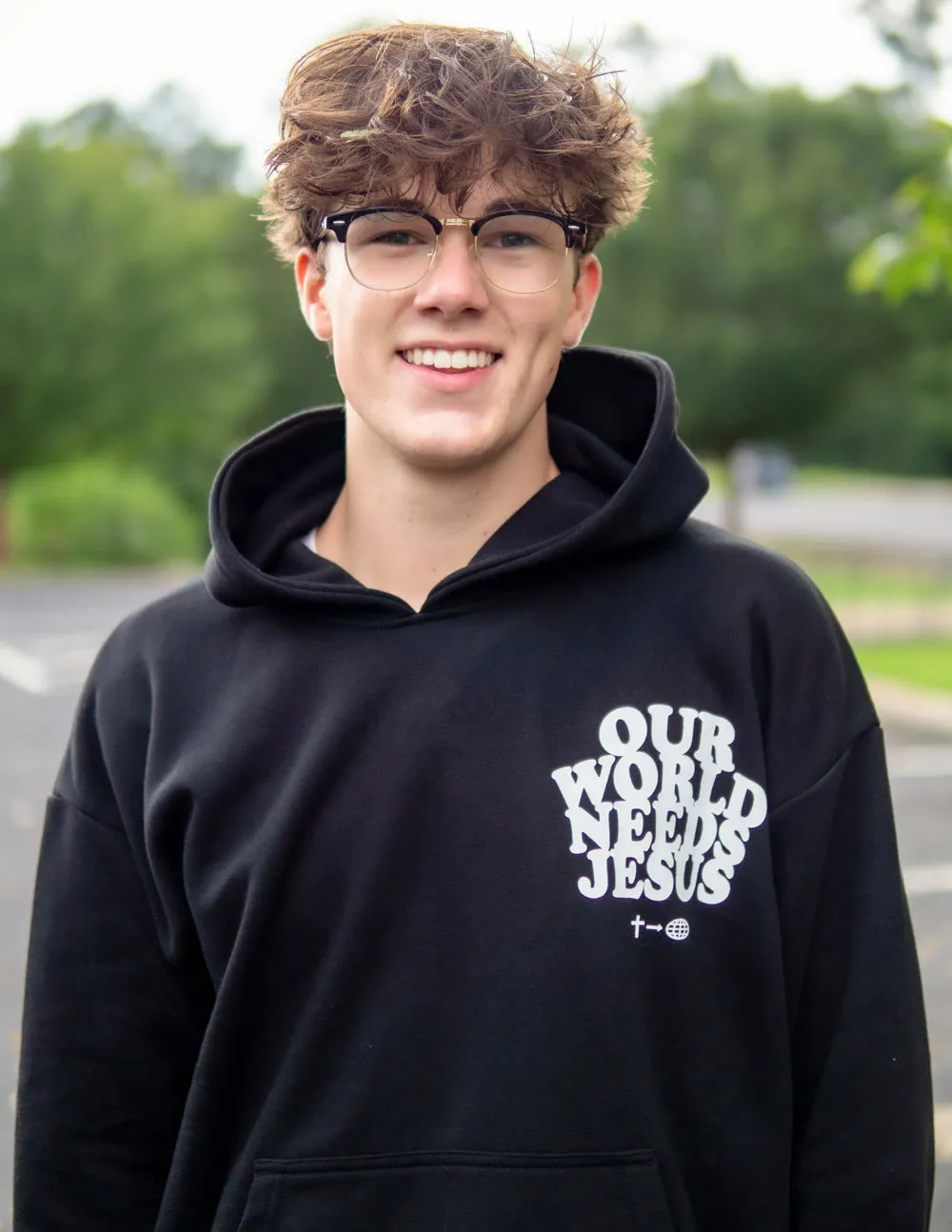 Our World Needs Jesus Black Unisex Hoodie